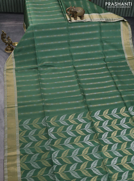 Pure soft silk saree green with allover zari weaves and zari woven simple border