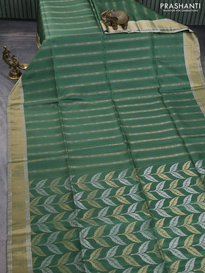 Pure soft silk saree green with allover zari weaves and zari woven simple border