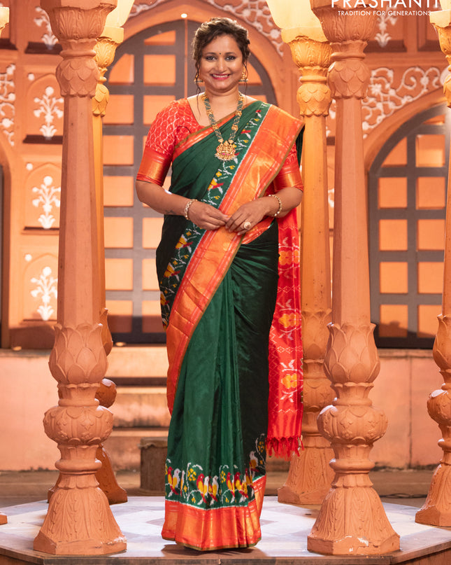 Pochampally silk saree green and red with plain body and long ikat design zari border