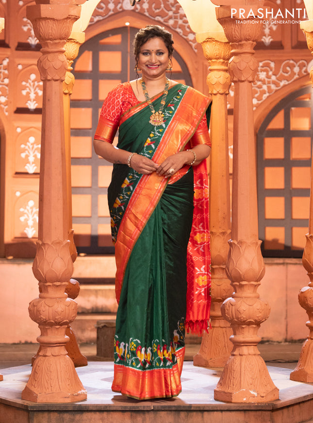Pochampally silk saree green and red with plain body and long ikat design zari border