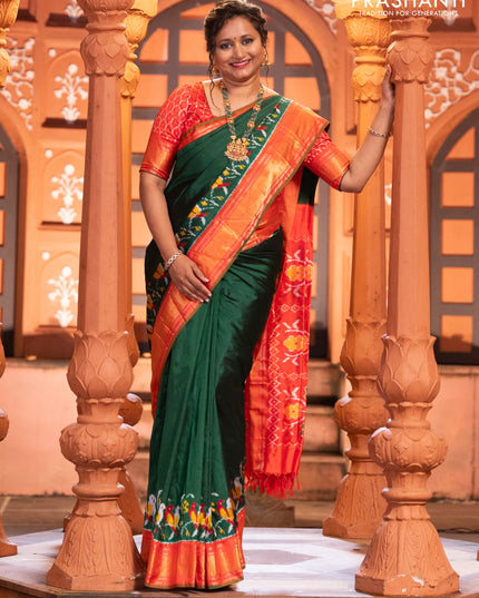 Pochampally silk saree green and red with plain body and long ikat design zari border