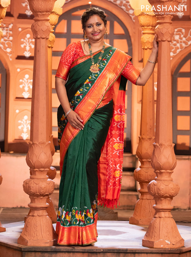 Pochampally silk saree green and red with plain body and long ikat design zari border