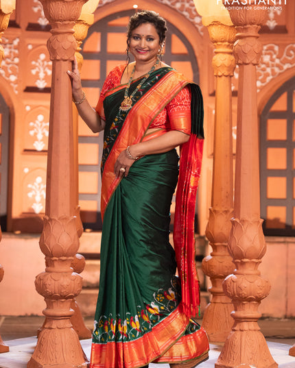 Pochampally silk saree green and red with plain body and long ikat design zari border
