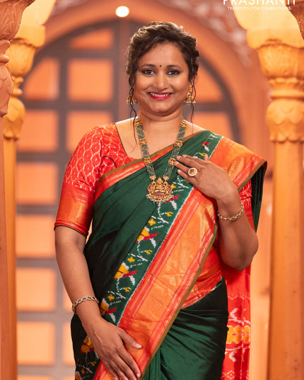Pochampally silk saree green and red with plain body and long ikat design zari border