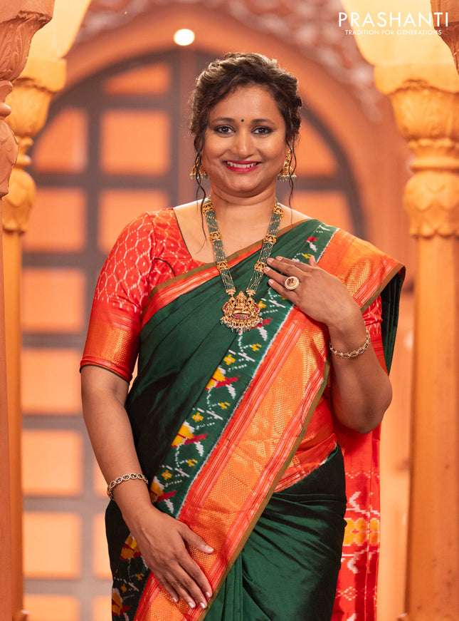 Pochampally silk saree green and red with plain body and long ikat design zari border