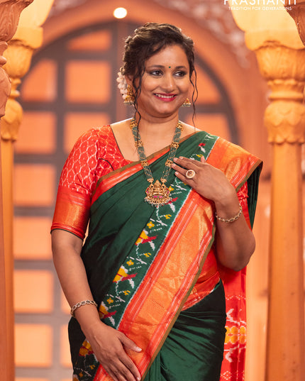 Pochampally silk saree green and red with plain body and long ikat design zari border