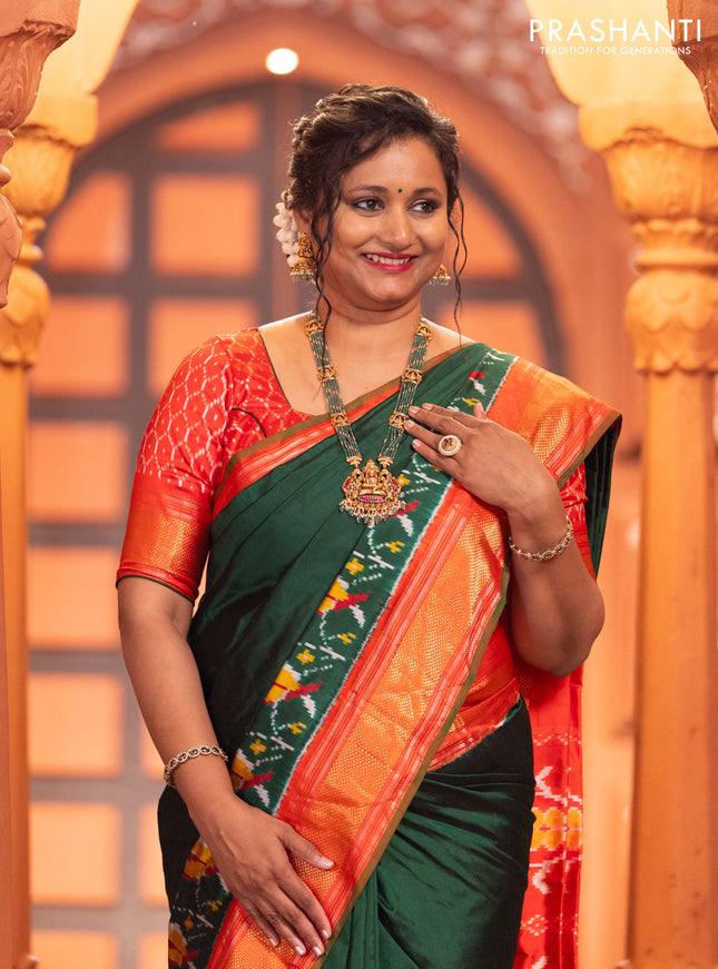 Pochampally silk saree green and red with plain body and long ikat design zari border