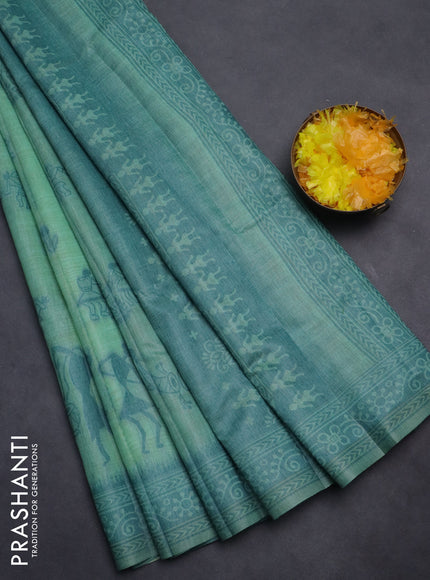 Semi jute silk saree teal green shade and peacock blue with thread woven buttas and warli design weaving pallu