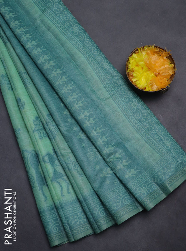 Semi jute silk saree teal green shade and peacock blue with thread woven buttas and warli design weaving pallu