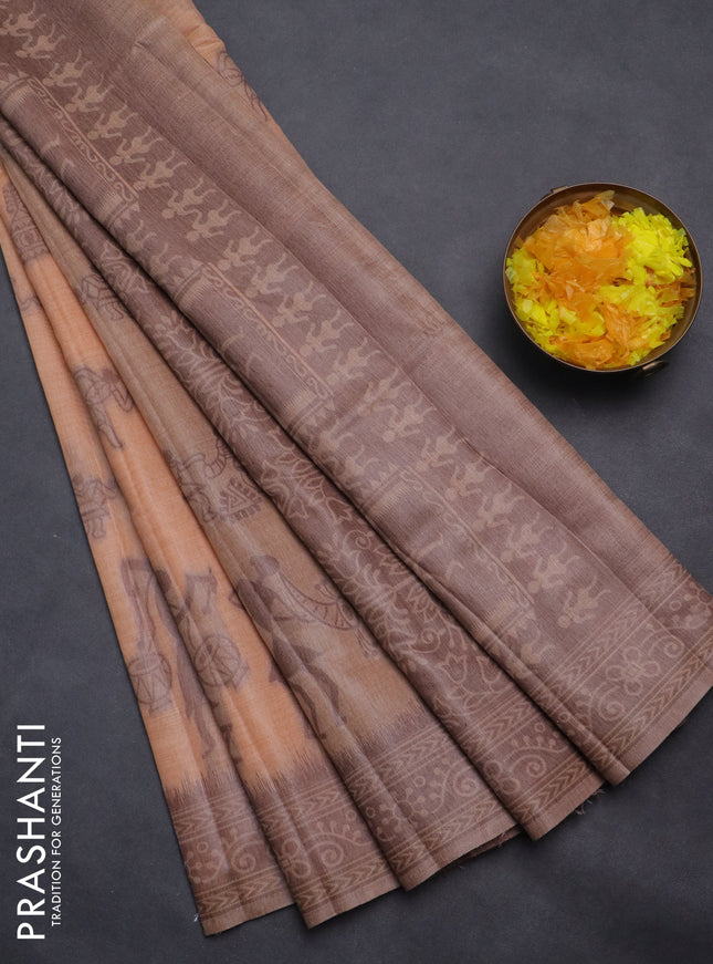 Semi jute silk saree pale orange and brown with thread woven buttas and warli design weaving pallu