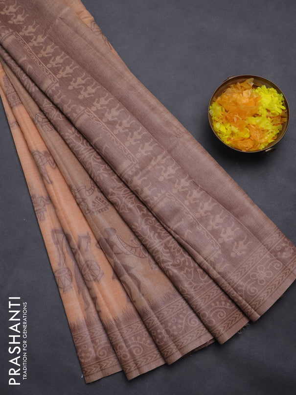 Semi jute silk saree pale orange and brown with thread woven buttas and warli design weaving pallu