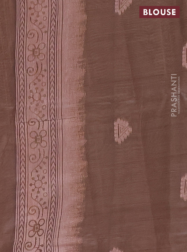 Semi jute silk saree pale orange and brown with thread woven buttas and warli design weaving pallu
