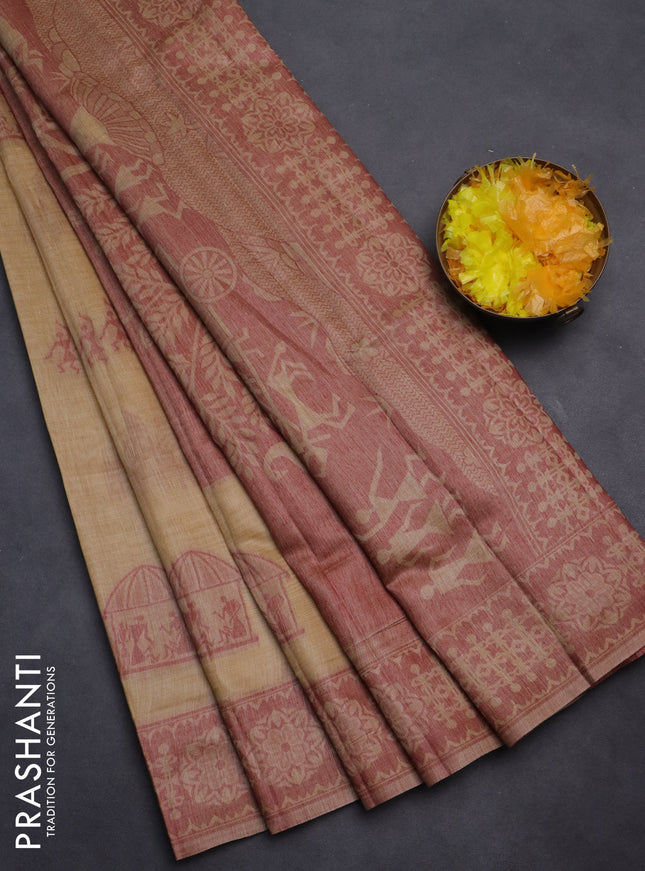 Semi jute silk saree sandal and maroon with thread woven warli buttas and warli design weaving pallu