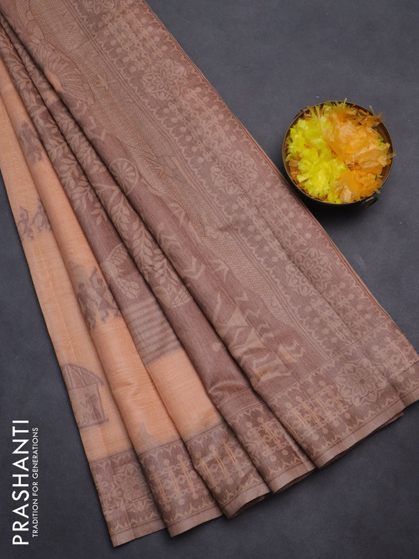 Semi jute silk saree pale orange and brown with thread woven warli buttas and warli design weaving pallu