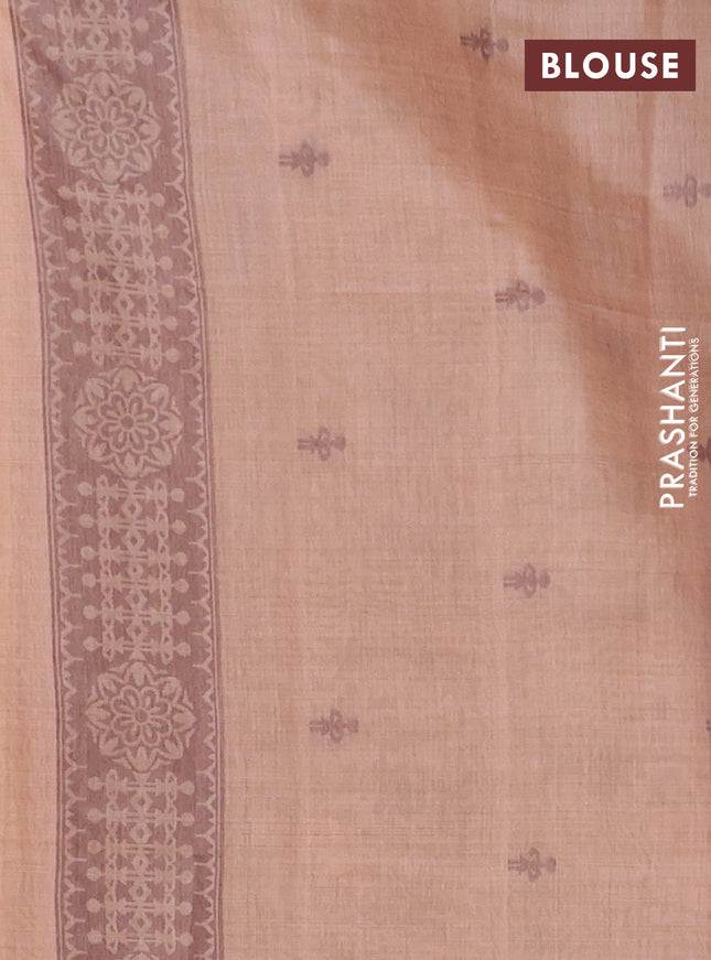 Semi jute silk saree pale orange and brown with thread woven warli buttas and warli design weaving pallu