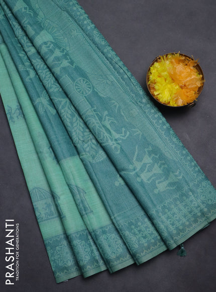 Semi jute silk saree teal green shade and peacock green with thread woven warli buttas and warli design weaving pallu