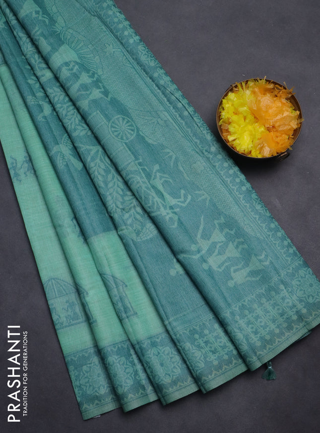 Semi jute silk saree teal green shade and peacock green with thread woven warli buttas and warli design weaving pallu