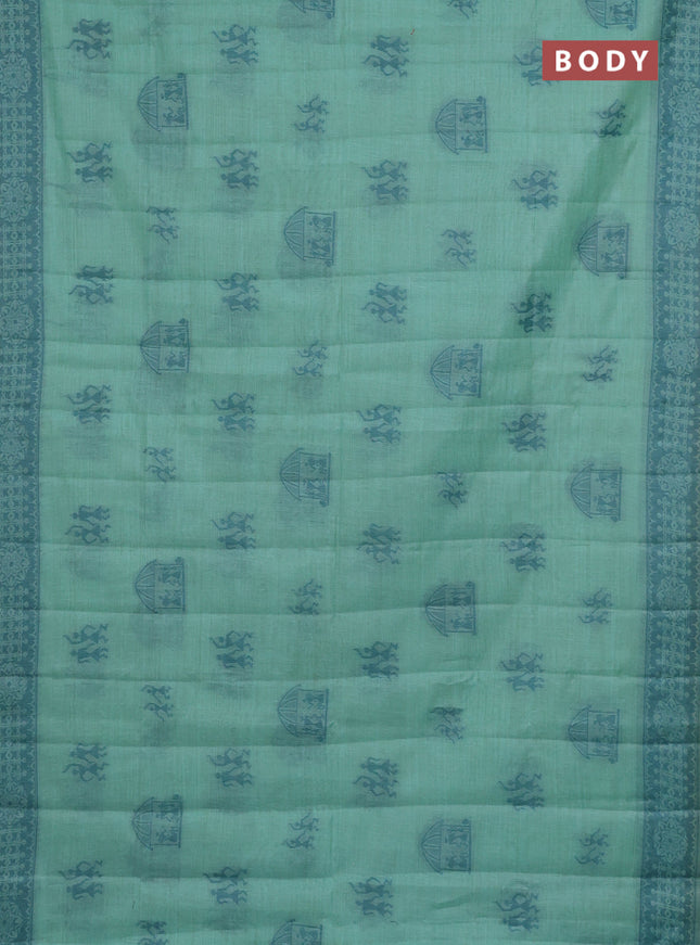 Semi jute silk saree teal green shade and peacock green with thread woven warli buttas and warli design weaving pallu