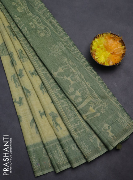 Semi jute silk saree pista green and green with warli thread woven buttas and warli design weaving pallu