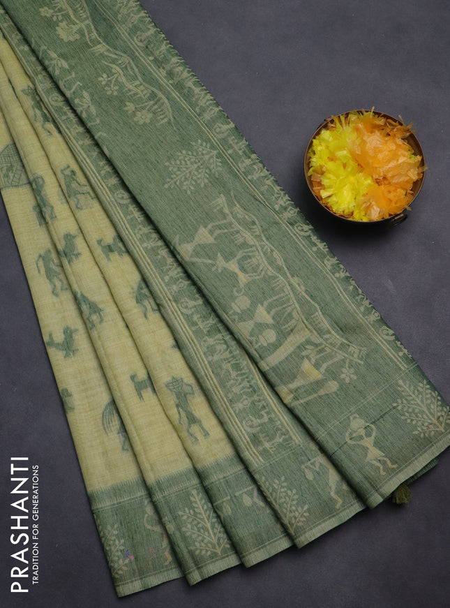 Semi jute silk saree pista green and green with warli thread woven buttas and warli design weaving pallu