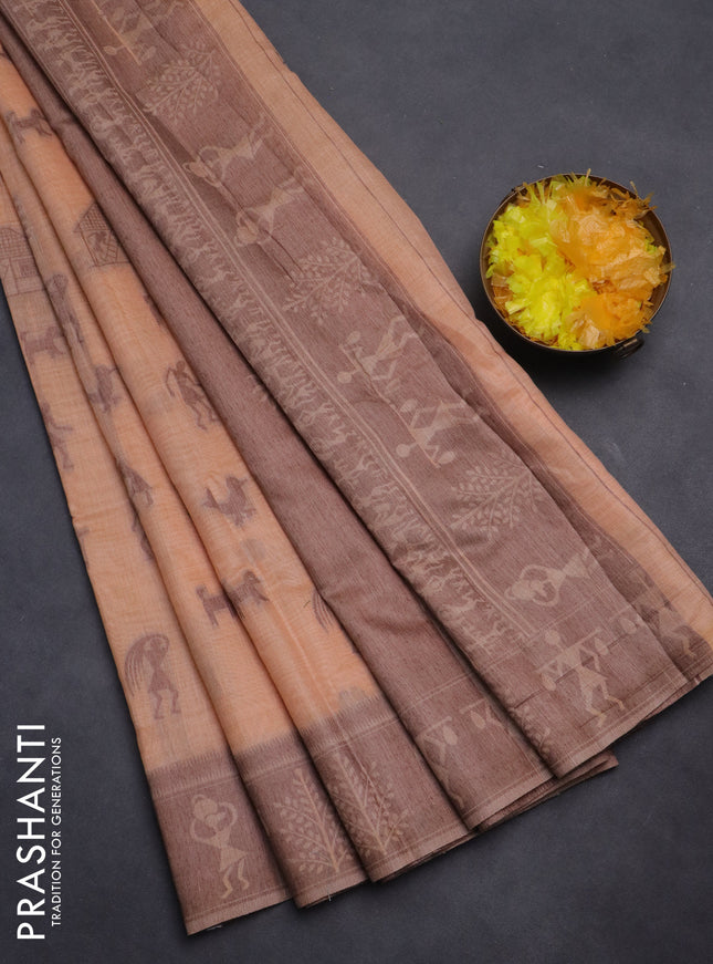 Semi jute silk saree pale orange and brown with warli thread woven buttas and warli design weaving pallu