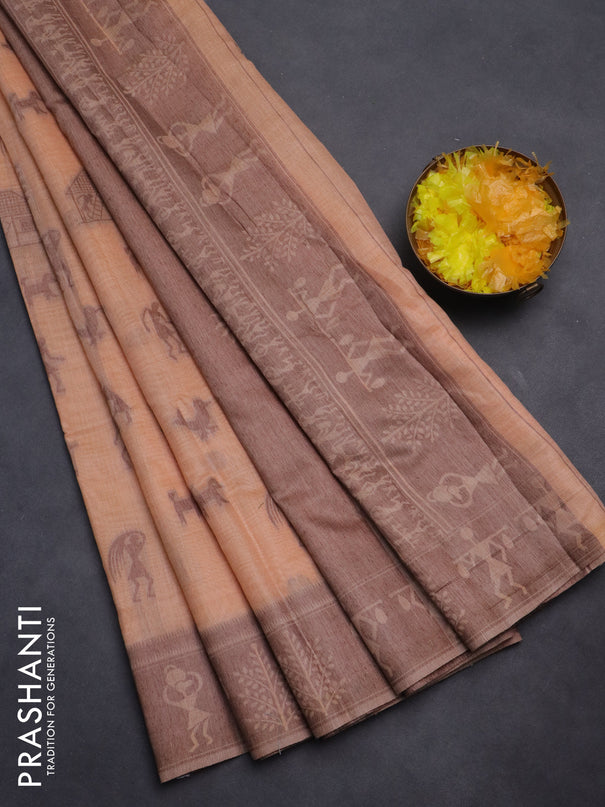 Semi jute silk saree pale orange and brown with warli thread woven buttas and warli design weaving pallu