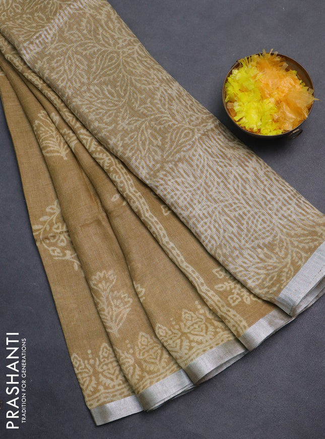 Pure linen saree sandal with allover butta prints and silver zari woven border