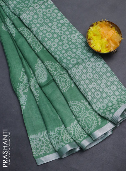 Pure linen saree green with allover butta prints and silver zari woven border