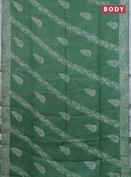 Pure linen saree green with allover butta prints and silver zari woven border