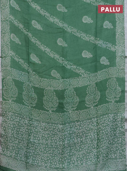 Pure linen saree green with allover butta prints and silver zari woven border