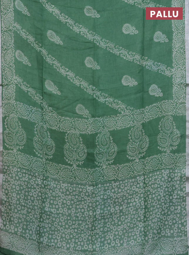Pure linen saree green with allover butta prints and silver zari woven border