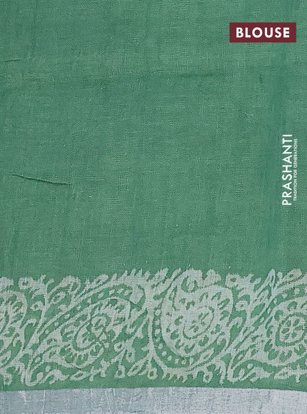 Pure linen saree green with allover butta prints and silver zari woven border
