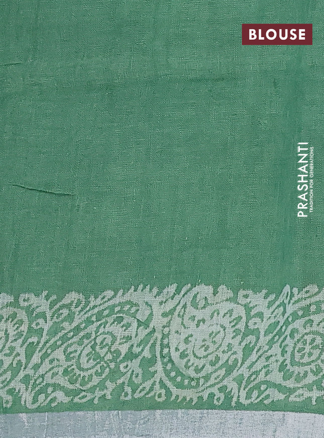 Pure linen saree green with allover butta prints and silver zari woven border