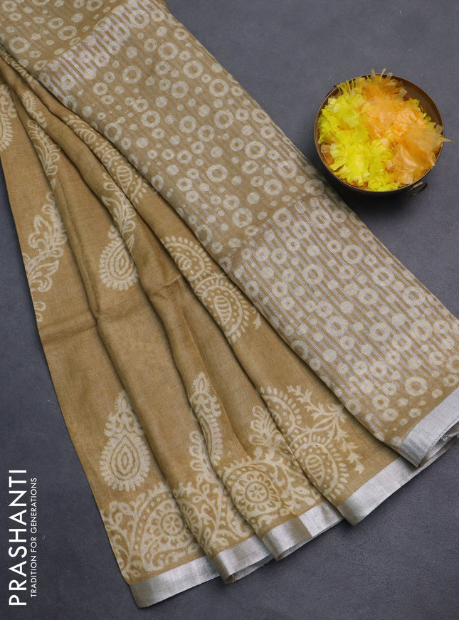 Pure linen saree sandal with allover butta prints and silver zari woven border