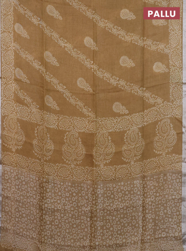 Pure linen saree sandal with allover butta prints and silver zari woven border