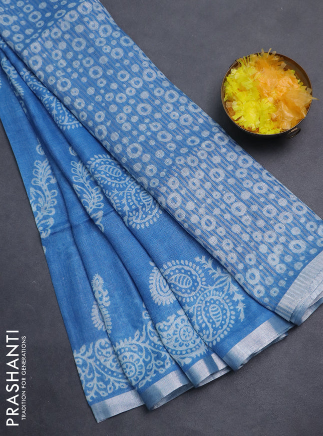 Pure linen saree cs blue with allover butta prints and silver zari woven border