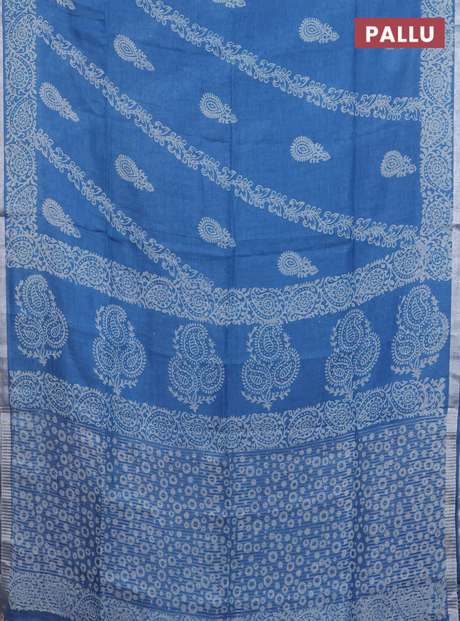 Pure linen saree cs blue with allover butta prints and silver zari woven border