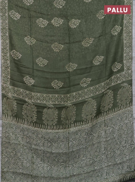 Pure linen saree sap green with allover butta prints and silver zari woven border