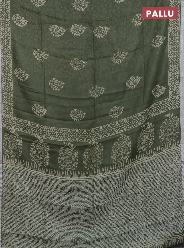 Pure linen saree sap green with allover butta prints and silver zari woven border