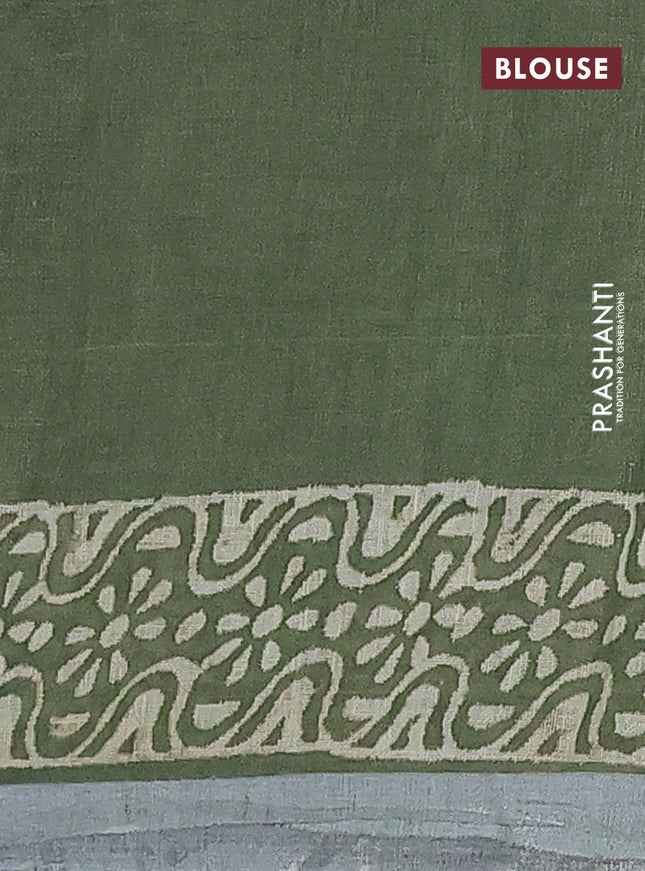 Pure linen saree sap green with allover butta prints and silver zari woven border