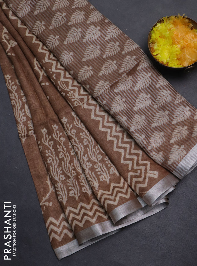 Pure linen saree brown with allover butta prints and silver zari woven border