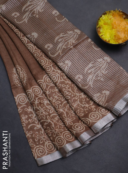 Pure linen saree brown shade with allover butta prints and silver zari woven border