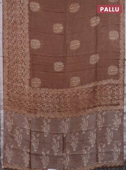 Pure linen saree brown shade with allover butta prints and silver zari woven border