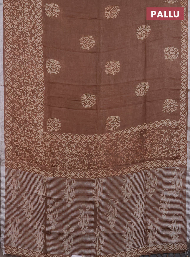 Pure linen saree brown shade with allover butta prints and silver zari woven border