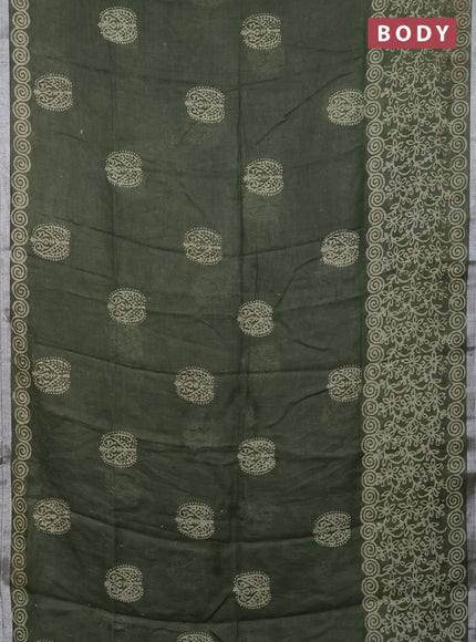 Pure linen saree sap green with allover butta prints and silver zari woven border
