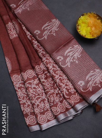 Pure linen saree rust shade with allover butta prints and silver zari woven border