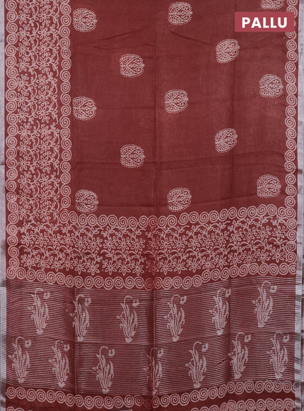 Pure linen saree rust shade with allover butta prints and silver zari woven border