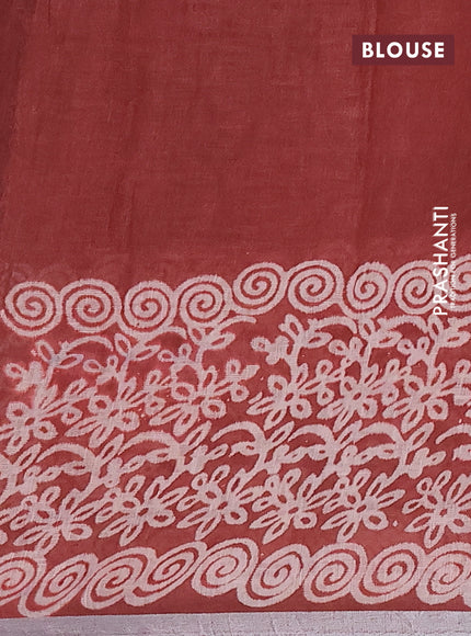 Pure linen saree rust shade with allover butta prints and silver zari woven border