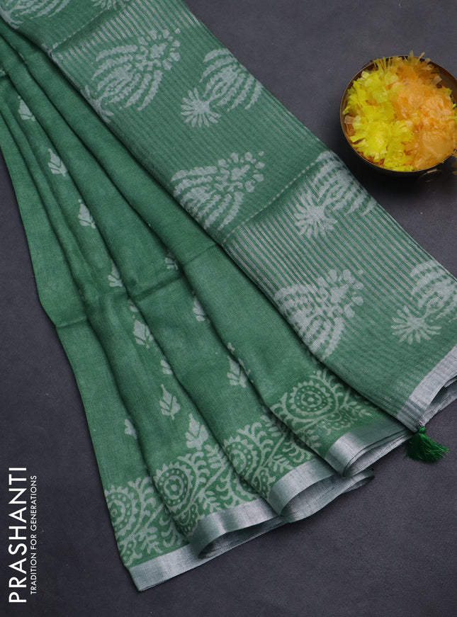 Pure linen saree green with allover butta prints and silver zari woven border
