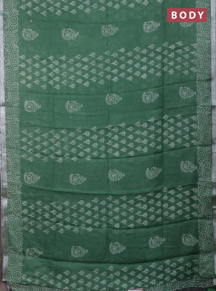 Pure linen saree green with allover butta prints and silver zari woven border